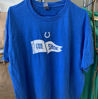 a blue T-shirt with the words for the shoe in white