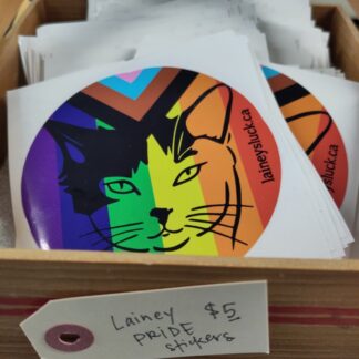 A basket filled with Lainey Pride stickers