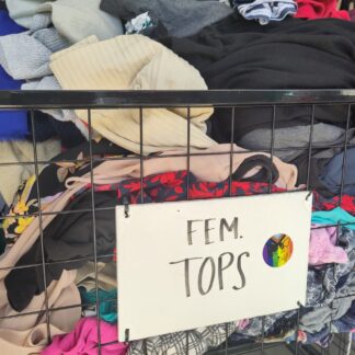 a wire metal bin with a sign that reads fem tops