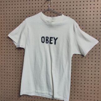 pale yellow t-shirt with the word OBEY in black letters